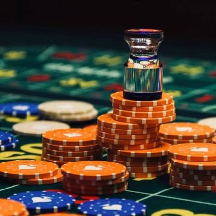 Poker-inspired table setup with event chips and cards